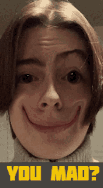 a woman making a funny face with the words " you mad " below her