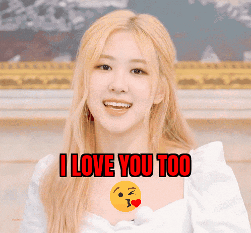 a woman with blonde hair is smiling with the words i love you too behind her