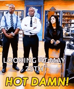a group of police officers are standing next to each other in a room .