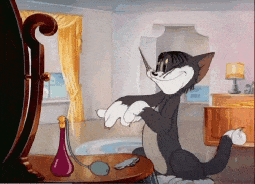 a tom and jerry cartoon shows tom cutting his hair