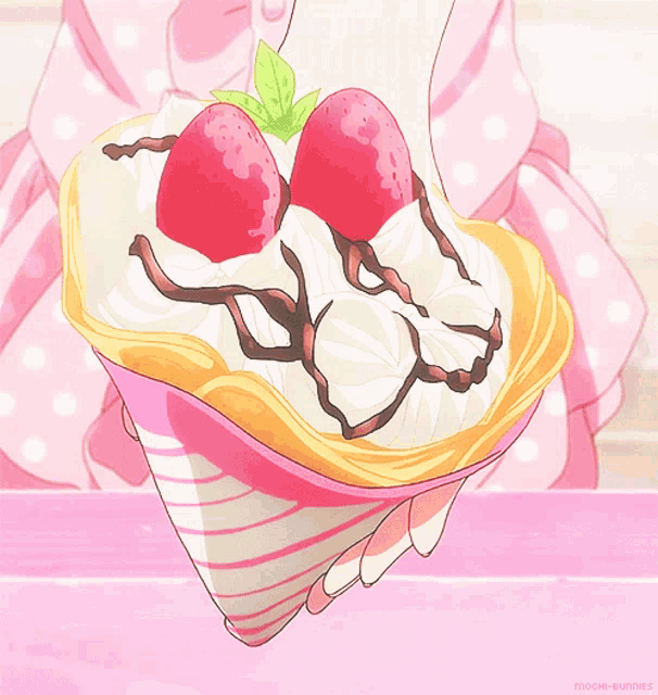 a person holding a heart shaped crepe with strawberries on top