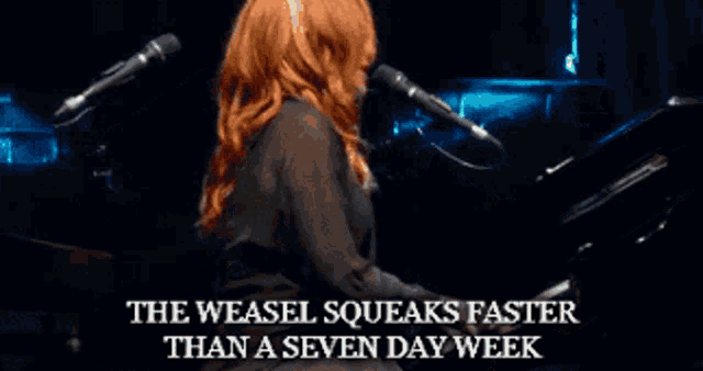 a woman singing into a microphone with the words the weasel squeaks faster than a seven day week