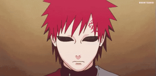 a close up of a person with red hair and black eyes