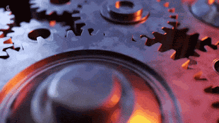 a close up of a mechanical device with gears moving