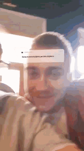 a close up of a man 's face with a sticker on his forehead that says ' dorse '