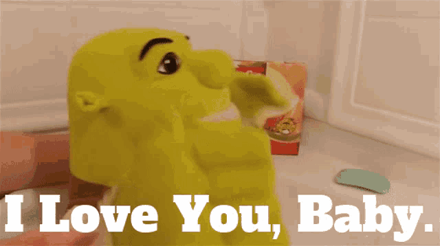 a shrek puppet says i love you baby in a bathtub
