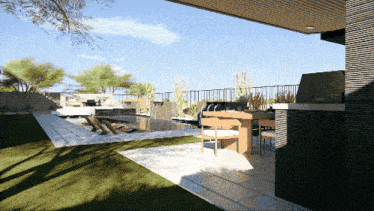 a patio with a table and chairs and a fence
