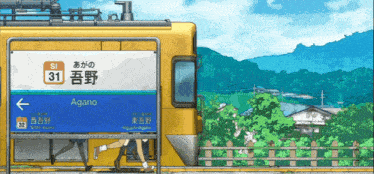 a yellow train with a blue sign that says agano on it