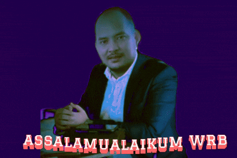 a man in a suit sits at a table with the words assalamualaikum wrb written below him