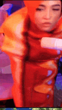 a blurry picture of a woman in a red costume with her eyes closed