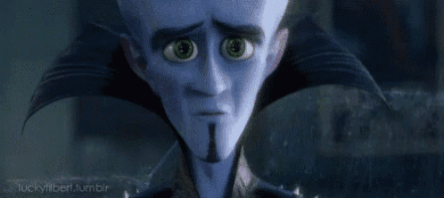 a cartoon character with a beard and green eyes is looking at the camera with a sad look on his face .