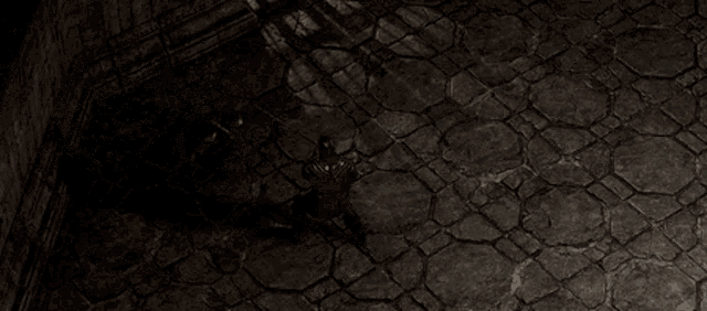 a person is standing in a dark room with a sword in their hand