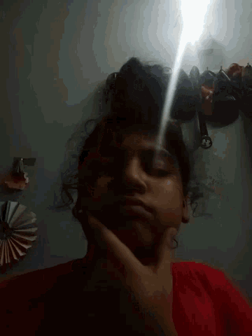 a person is taking a picture of themselves with a flashlight