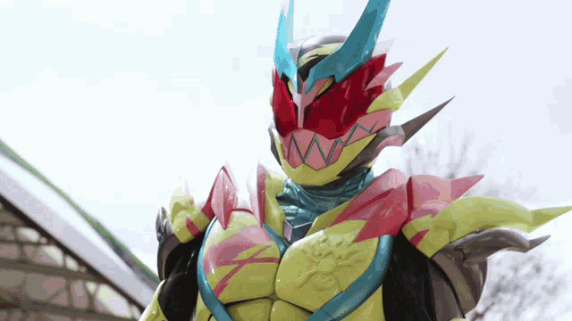 a cartoon character is wearing a yellow and blue costume with a red mask