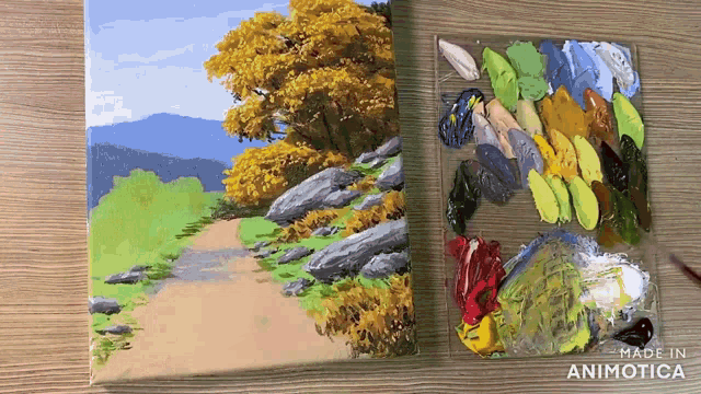 a painting of a path next to a palette with the words made in animatica on the bottom