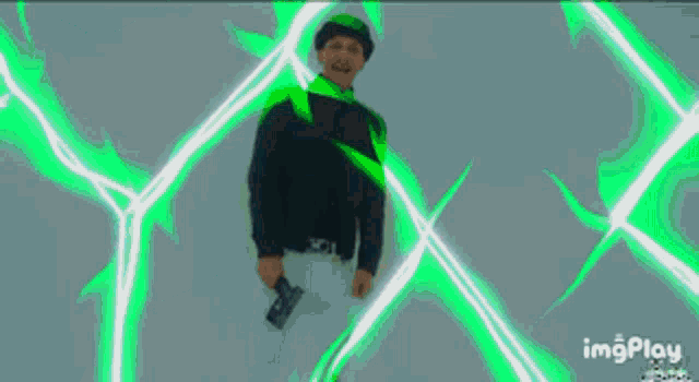 a blurry picture of a person with a green light coming out of their hand
