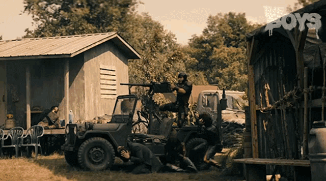 a group of men are fighting in a field with a sign that says the boys on it