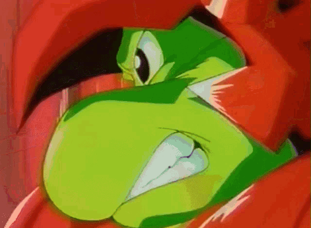 a close up of a cartoon character with a green face