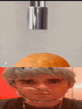 a man 's face is being sliced by a slicer with a tiktok logo on the bottom right