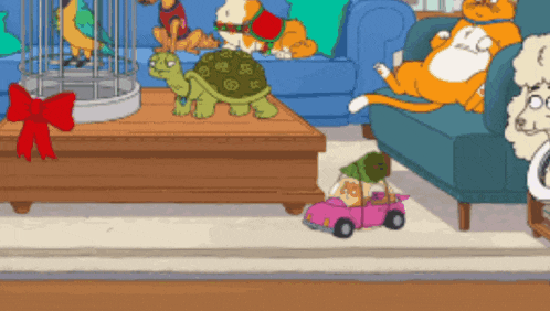 a turtle sits on a coffee table in a living room with other animals