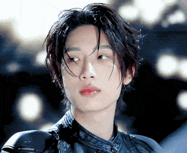 a close up of a young man with wet hair