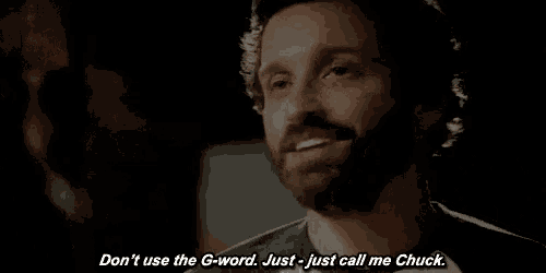a man with a beard is smiling and saying " don 't use the g-word just call me chuck "