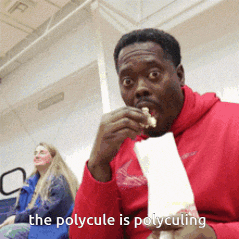 a man in a red hoodie is eating a piece of food with the words the polycule is polyculating behind him