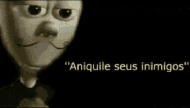 a close up of a cartoon character 's face with the words `` aniquile seus inimigos '' written below it .