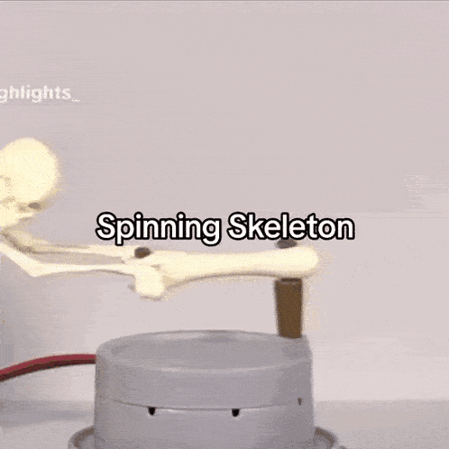 a spinning skeleton with a cigarette sticking out of it 's mouth