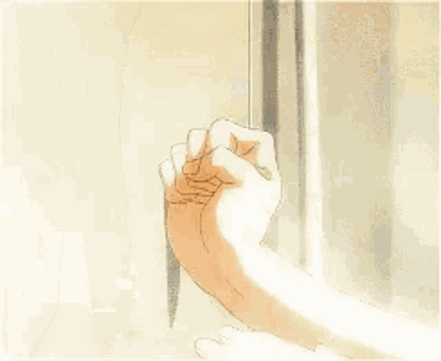 a man is leaning against a wall with his hand on it .