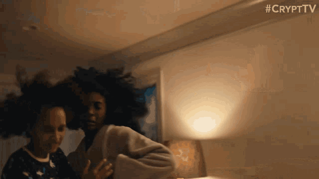 two women are dancing in a room with #crypttv written on the bottom of the image