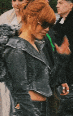 a blurry picture of a woman wearing sunglasses