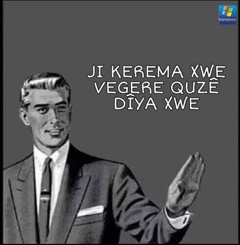 a man in a suit and tie says ji kerema xwe