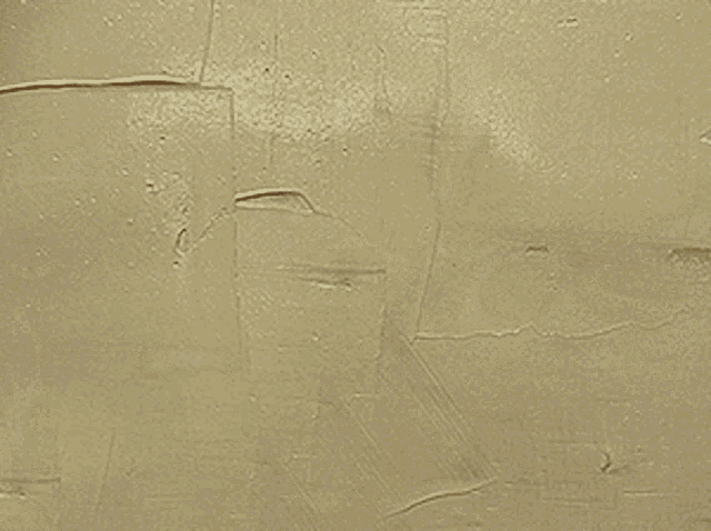 a close up of a wall with a cracked texture
