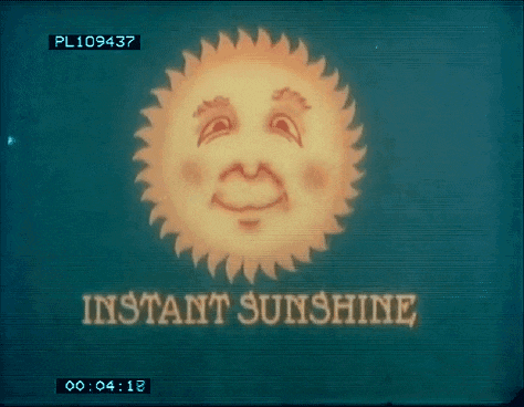 a screen shows a sun with a face and the words instant sunshine below it