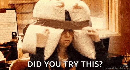 a woman wearing a pillow on her head with the words did you try this on the bottom