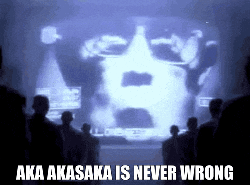 a group of people are looking at a screen that says aka akasaka is never wrong .