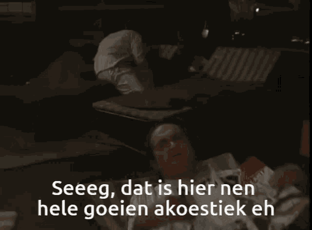 a man is laying on the floor with the words seeeg dat is hier nen hele goeien akoestiek eh