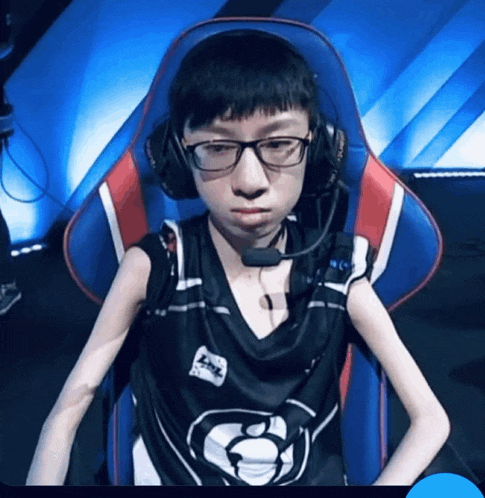 a man wearing headphones and a shirt that says lpl