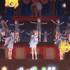 a group of people are dancing on a stage in a video game .