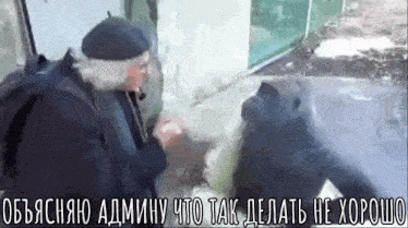 a man in a beret is talking to another man in a foreign language .