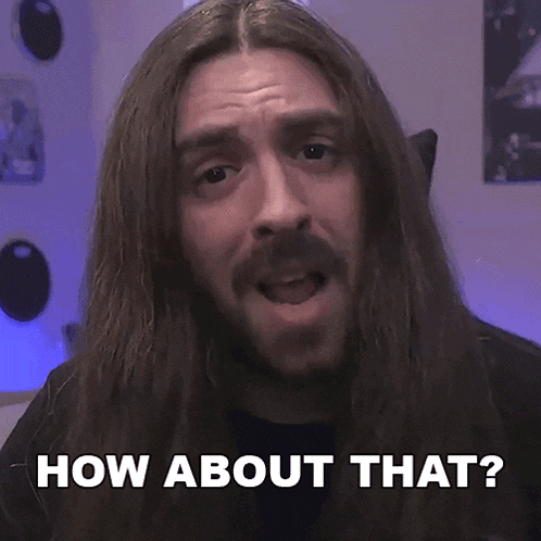 a man with long hair and a beard asking how about that