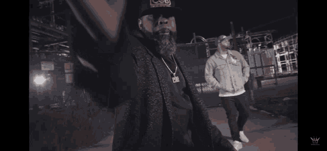 a man wearing a hat that says cub is dancing with another man