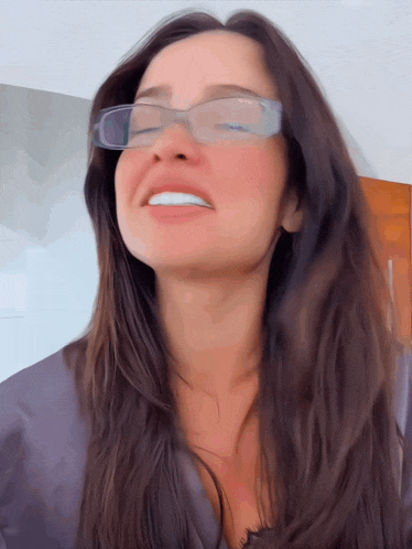 a close up of a woman wearing glasses