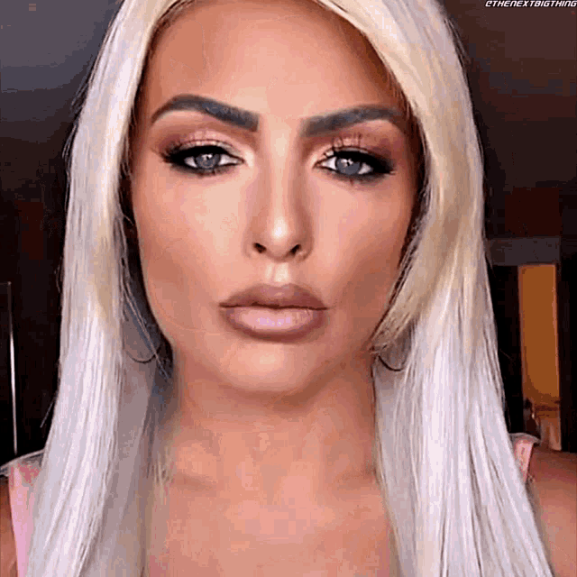 a close up of a woman 's face with the hashtag #thenextbig thing