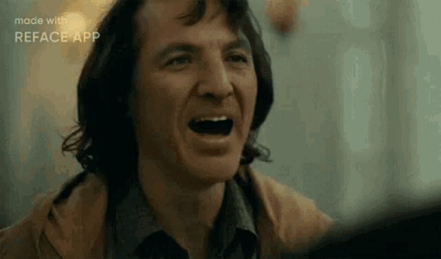 a close up of a man laughing with his mouth open in a reface app .