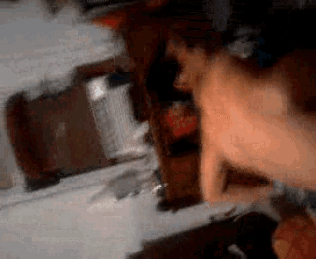 a blurry image of a person laying on a bed