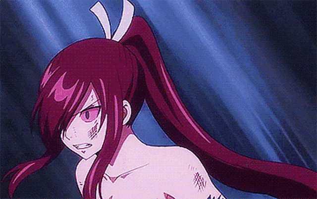 a girl with long red hair and a ponytail is standing in front of a blue background .