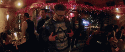 a man in a sweater with a star of david on it