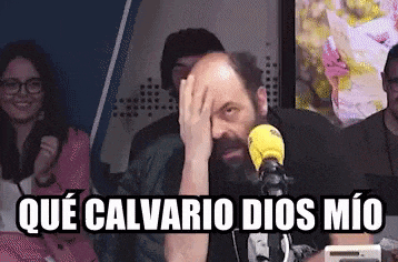 a man sitting in front of a microphone with the words que calvario dios mio written above him